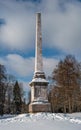 Chesma obelisk in Gatchina Park. Sunny winter`s day.