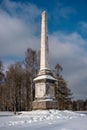 Chesma obelisk in Gatchina Park. Sunny winter`s day.