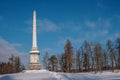 Chesma obelisk in Gatchina Park. Sunny winter`s day.