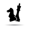 Chess. 2 black floating silhouettes of chess pieces. The king and the horse. Vector illustration isolated on a white background