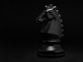 Chess. Black Knight on black background.