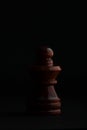 Chess. Black Pawn on black background.