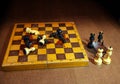 Chess black and white kings and queens celebrating with glasses of wine Royalty Free Stock Photo