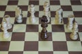 Chess Board - Black King surrounded by enemies. Royalty Free Stock Photo