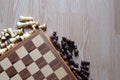 Chess board and chess figures on wooden table. Flay layout