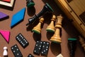 Chess board and chess pieces. desktop games, on the brown table. Home entertaiment, indoor games.