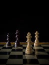 Chess board game concept of battle, war and strategy. Chess figures on a dark background with smoke and fog. Selective focus Royalty Free Stock Photo