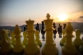 chess board game concept of business ideas and competition and strategy ideas. Chess figures on a chessboard outdoor sunset backgr Royalty Free Stock Photo