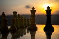 chess board game concept of business ideas and competition and strategy ideas. Chess figures on a chessboard outdoor sunset backgr Royalty Free Stock Photo