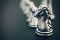 Chess board game staying against full set of chess pieces. Royalty Free Stock Photo