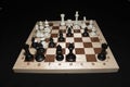 Chess board and the pieces as a strategy background Royalty Free Stock Photo