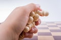 Chess board with chess pieces in hand Royalty Free Stock Photo