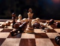 A chess board with pieces knocked over, mirroring the pain of defeat and strategic failures