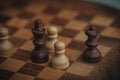 Chess board and chess pieces, Wooden chess pieces on a chess board. Close-up, pawn and queen, dark and light Royalty Free Stock Photo