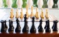 Chess board set up and ready to play. Narrow depth of field Royalty Free Stock Photo