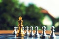 Chess board, silver pawns stand as wall barrier against Golden king Royalty Free Stock Photo