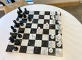 A chess board on a table in a recreation room at a luxury apartment building Royalty Free Stock Photo