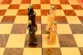 Chess board with two kings and two queens Royalty Free Stock Photo