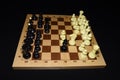 Chess board with white chessmen for leisure theme Royalty Free Stock Photo