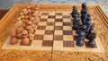 Wooden chess boards and chess pieces with typical Balinese carvings.