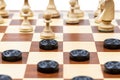 chess and checkers gaming on board closeup Royalty Free Stock Photo