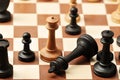 Chess on a chessboard - white queen checkmates black king