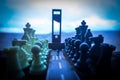 Chess concept of business and strategy ideas. Silhouette of a man standing in the middle of the road with giant chess figures and