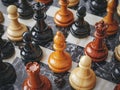 Chess. Different, chess pieces on a shiny black, polished stone background. A game that makes you think. Generative Ai Royalty Free Stock Photo