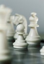 Chess figure pawn on board. Chess game play closeup. Chess figures with focus on pawn. Royalty Free Stock Photo