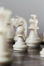 Chess figure pawn on the board. White chess figures Knight, Bishop, Pawn. Royalty Free Stock Photo