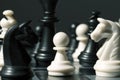 Chess figure pawn on the board. White pawn in black figures on chessboard. Royalty Free Stock Photo