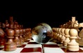 Chess figures against earth globe Royalty Free Stock Photo