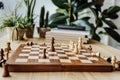 Chess figures on chessboard during the game at home