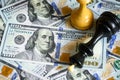 Chess figures on US dollar bills pile, king lies on cash