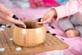 In a chess game, an adult`s hand and a child`s hand put the pieces into the chess box at the same time Royalty Free Stock Photo