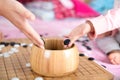 In a chess game, an adult`s hand and a child`s hand put the pieces into the chess box at the same time Royalty Free Stock Photo