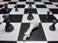 Chess game black king defeating white king stock photos Royalty Free Stock Photo