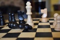 Chess game board with chess wooden pieces Royalty Free Stock Photo