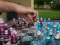 Chess game on a chessboard decorated in pink and blue with pieces with floral motifs Royalty Free Stock Photo