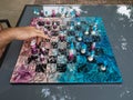 Chess game on a chessboard decorated in pink and blue with pieces with floral motifs Royalty Free Stock Photo