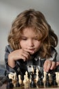 Chess game with children at home. Little kid play chess. Thinking child. Chess game for kids. Intelligent, smart and Royalty Free Stock Photo