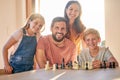 Chess, game and family playing, learning and teaching in the living room of their house together. Games, happy and Royalty Free Stock Photo