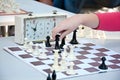 Chess game. Girl playing chess in the park