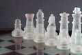 Chess with game pieces made of glass, queen, king, pawn and game board made of glass Royalty Free Stock Photo