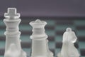 Chess with game pieces made of glass, queen, king, pawn and game board made of glass Royalty Free Stock Photo