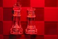 Chess with game pieces made of glass, queen, king, pawn and game board made of glass Royalty Free Stock Photo