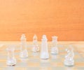 Chess glass on board game. On a vintage wooden floor background Concept competition business success