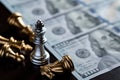 Chess King stand over the enemies with US dollar banknote. The winner in business competition. Competitiveness and strategy