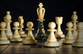 Chess: a pawn surrounded by strong powers Royalty Free Stock Photo