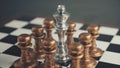 Chess many against one. Concept of teamwork. Pawns surrounded the metal king Royalty Free Stock Photo